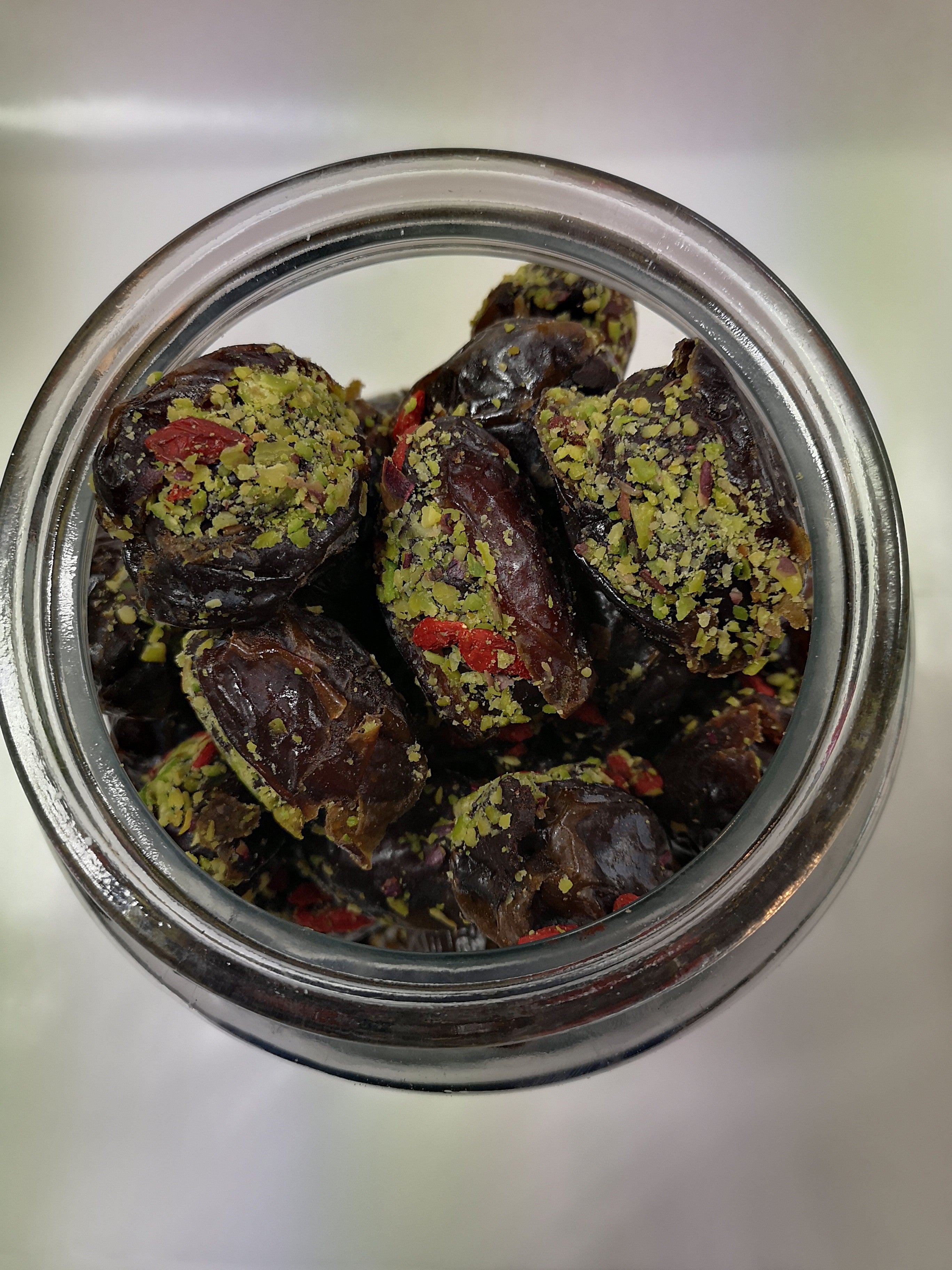 Dates with pistachio cream, pistachios, and goji berries